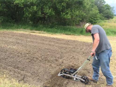Using a new Precision Garden Seeder to plant the sorghum/broom corn